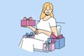 Pregnant woman with gift box strokes belly and looks at screen in anticipation of birth of baby Royalty Free Stock Photo