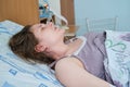 A pregnant woman gives birth in a hospital with a drip and a CTG machine Royalty Free Stock Photo