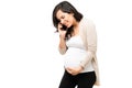 Pregnant woman going into labor and calling 911 emergency Royalty Free Stock Photo