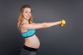 Pregnant woman going in for sport Royalty Free Stock Photo