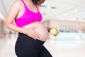 Pregnant woman with green apple in hospital Royalty Free Stock Photo