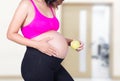 Pregnant woman with green apple in hospital Royalty Free Stock Photo