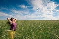 Pregnant woman on green grass field under blue sky Royalty Free Stock Photo