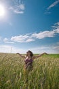 Pregnant woman on green grass field under blue sky Royalty Free Stock Photo