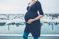 Pregnant woman in harbor