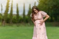 Pregnant woman has a stomachache in park Royalty Free Stock Photo