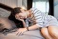 Pregnant woman having headache,vertigo while getting up from bed,blood pressure abnormalities feeling dizzy and faint,symptom of Royalty Free Stock Photo