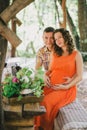 Pregnant woman having lunch with her husband in a forest Royalty Free Stock Photo