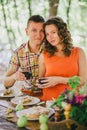 Pregnant woman having lunch with her husband in a forest Royalty Free Stock Photo