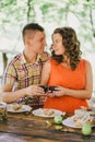 Pregnant woman having lunch with her husband in a forest Royalty Free Stock Photo