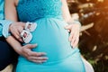 Pregnant woman and her husband holding hands on tummy with girls Royalty Free Stock Photo