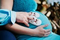 Pregnant woman and her husband holding hands on tummy with girls Royalty Free Stock Photo