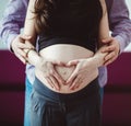 A pregnant woman with her husband waiting for a newborn baby. Royalty Free Stock Photo