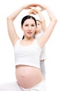 Pregnant woman and her son together doing exercises Royalty Free Stock Photo