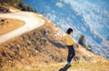 Pregnant woman on hill with great view