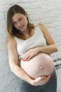 Pregnant woman hold her tummy