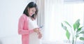 Pregnant woman hold picture