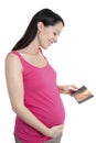 Pregnant woman holding 4d scan