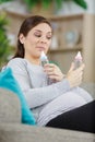 pregnant woman holding baby bottle Royalty Free Stock Photo