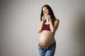 Pregnant woman holding baby socks Royalty Free Stock Photo