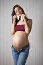 Pregnant woman holding baby socks Royalty Free Stock Photo
