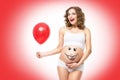 Pregnant woman holding balloon Royalty Free Stock Photo