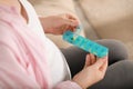 Pregnant woman holding box with pills on blurred background, closeup Royalty Free Stock Photo