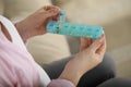 Pregnant woman holding box with pills on blurred background, closeup Royalty Free Stock Photo