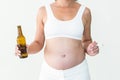 Pregnant woman holding cigarette and beer bottle Royalty Free Stock Photo