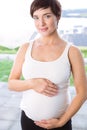 Pregnant woman holding her bump Royalty Free Stock Photo