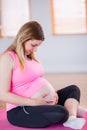 Pregnant woman holding her bump Royalty Free Stock Photo