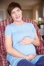 Pregnant woman holding her bump Royalty Free Stock Photo