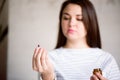 Pregnant woman holding medicine. Girl holding pills in her hands. Royalty Free Stock Photo