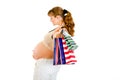 Pregnant woman holding shopping bags in hand Royalty Free Stock Photo