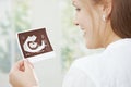 Pregnant woman holding sonogram Royalty Free Stock Photo