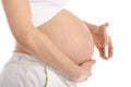 Pregnant woman holding a test tube with sperm