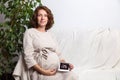 Pregnant woman holding ultrasound image. Concept of pregnancy, health care, gynecology, medicine. Young mother waiting Royalty Free Stock Photo