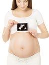 Pregnant woman holding ultrasound scan photo of baby over belly, white background. Prenatal health care concept