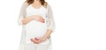 Pregnant woman holds hands on belly on a white background. Pregnancy, maternity, preparation and expectation concept. Close-up