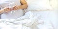 A pregnant woman hugs her belly with a toy. Selective focus Royalty Free Stock Photo