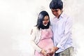 Pregnant woman with husband and hug on white background on watercolor illustration painting background Royalty Free Stock Photo
