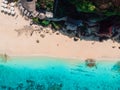 Pregnant woman with husband relaxing at tropical beach with ocean. Aerial view Royalty Free Stock Photo