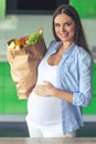 Pregnant woman in the kitchen Royalty Free Stock Photo