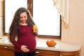 Pregnant woman on kitchen with healthy food. Healthy nutrition and diet during pregnancy