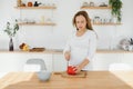 Pregnant woman in kitchen making salad Royalty Free Stock Photo