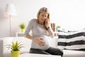 Pregnant woman in labor calling hospital Royalty Free Stock Photo