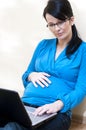 Pregnant woman and laptop