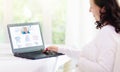 Pregnant woman laptop. Pregnancy online shopping Royalty Free Stock Photo