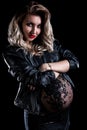 Pregnant woman in a leather jacket Royalty Free Stock Photo