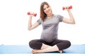 Pregnant woman lifting weights